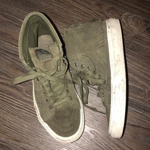 A pair of green Vans